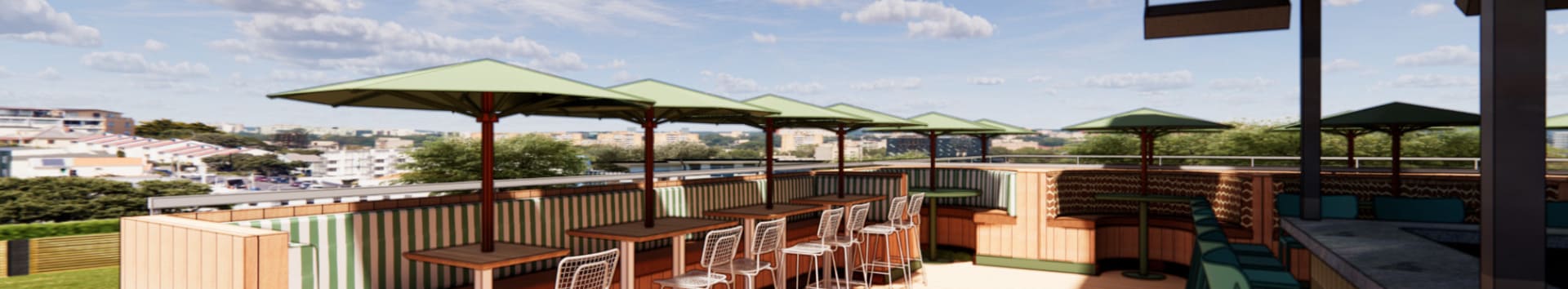 Outdoor rooftop bar with shaded seating, featuring green umbrellas, striped booth backs, and a city skyline in the background.